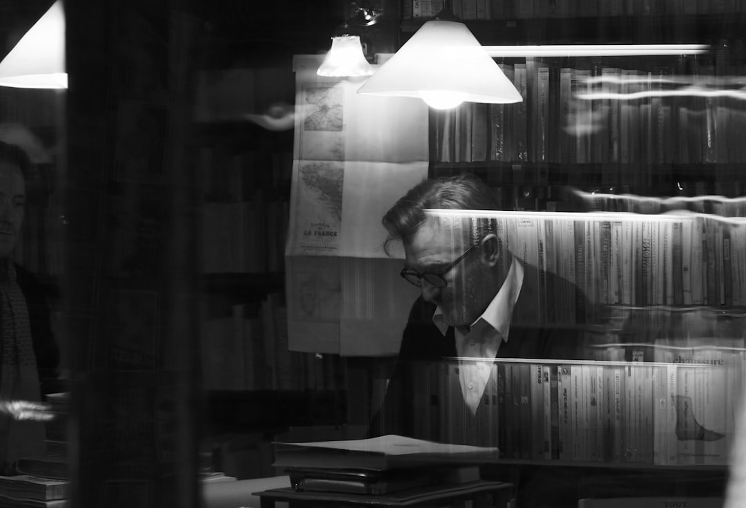 detective reading book at night