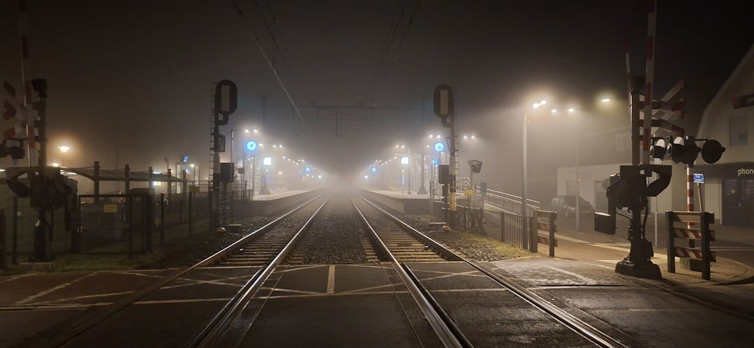 Book cover with train station platform at night in fog